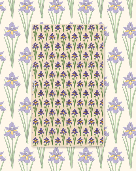 Yellow and green black-eyed Susan pattern towel laid flat over a matching daisy print background