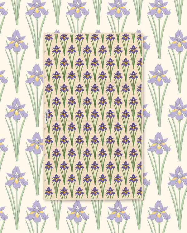 Yellow and green black-eyed Susan pattern towel laid flat over a matching daisy print background