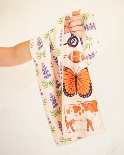 Texas Kitchen & Tea Towel with designs of butterflies, flowers, and Texas themes, showcasing vibrant colors and fun patterns.