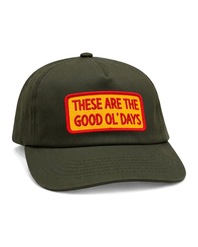 These Are The Good Ol' Days Hat in olive green twill with a yellow and red embroidered patch, on white