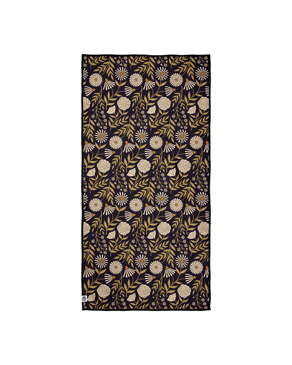 Travelin' Light Wander & Travel Towel with floral pattern, sand-resistant and quick-drying, made from recycled materials.