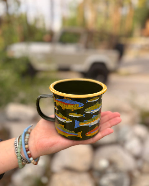 Trout Mug - Enamel 16oz Mug with vibrant trout design in hand, perfect for hot or cold beverages.