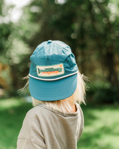 Trout Kids Hat showcased on a toddler, perfect for little anglers, ideal for outdoor adventures and fun.