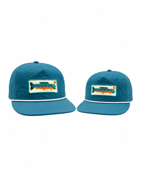 Trout Hat Twinsie Set Blue: two teal blue caps with white rope and trout patches, adult and kid size, on white