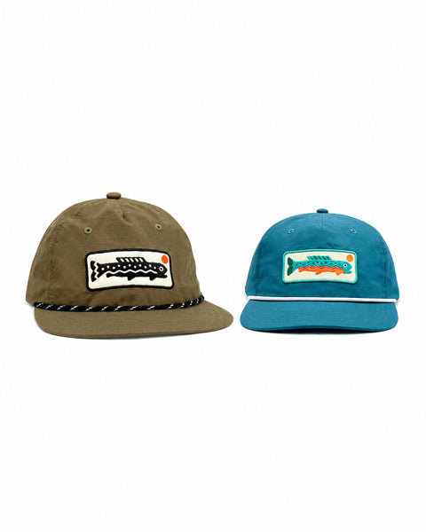 The Trout Hat Twinsie Set with the olive adult hat and blue kids hat, both with trout patches, Trek Light