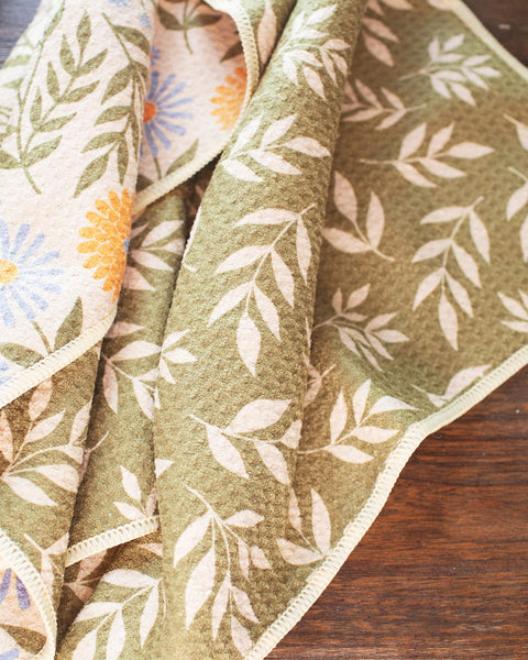 Wavy Flowers Kitchen & Tea Towel featuring vibrant floral designs and eco-friendly fabric, perfect for drying and cleaning.