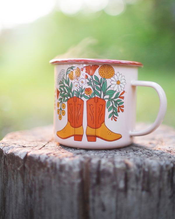 Western Bloom enamel mug 16oz with floral boot design, perfect for adventures. Durable and delightful, by Trek Light.