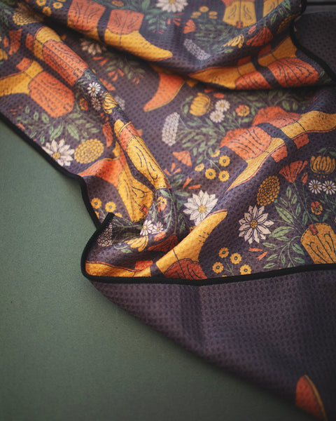 Western Bloom Kitchen & Tea Towel featuring vibrant floral and cowboy boot design on recycled microfiber fabric.