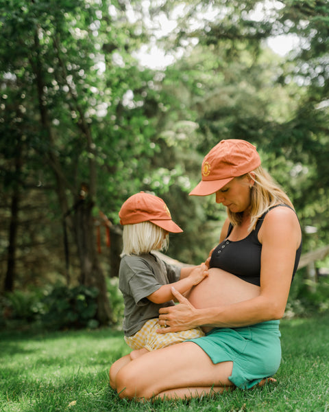 Mom and child wearing You Are My Sunshine Hat - Twinsie Set, bonding in a sunny outdoor setting.
