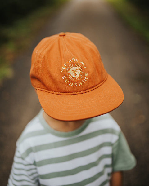 You Are My Sunshine Kids Hat for toddlers, featuring a sunny design in orange, perfect for sunny days and playground fun.