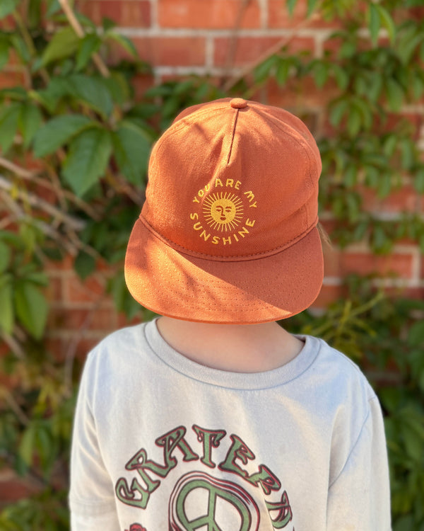 You Are My Sunshine Kids Hat shown on a child, perfect for sunny days and outdoor play.