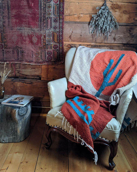 Beautiful and cozy Arizona Blanket by Trek Light, handwoven from recycled clothing, featuring a cactus design, versatile decor.