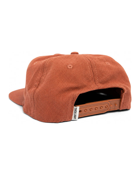 Back view of Trek Light 'You Are My Sunshine' kids snapback hat in rust color, showing adjustable strap and flat brim design.