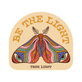 Colorful 'Be The Light' Trek Light sticker with artistic moth design, made in the USA on weatherproof vinyl, size 3.1" x 2.8".