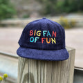 Colorful 'Big Fan Of Fun' kids snapback hat, 100% cotton corduroy, outdoor setting. Perfect gift idea from Trek Light. Unisex fit.