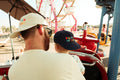 Big Fan Of Fun Hat - Twinsie Set worn by adult and child at amusement park, showcasing matching hats.