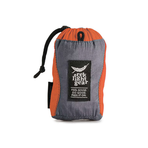 Trek Light Gear Bindle Daypack - ultralight, ultra-strong backpack ideal for day adventures, packed compactly in orange and grey.