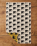 Black Cats waffle kitchen tea towel flat lay with a corner folded up to reveal the reverse print