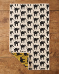 Black Cats waffle kitchen tea towel flat lay with a corner folded up to reveal the reverse print