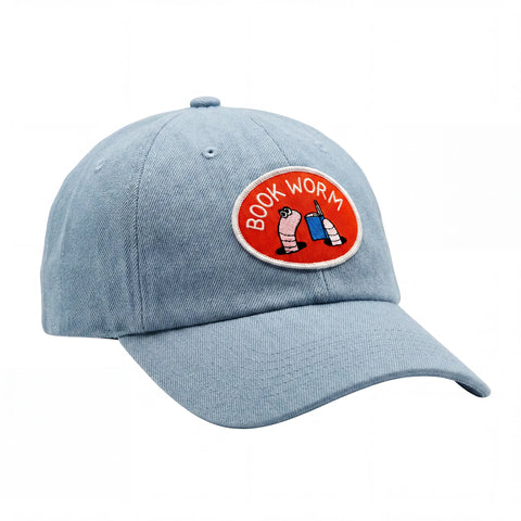 Book Worm Hat featuring a playful design with a blue fabric and embroidered patch.