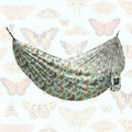Double Hammock (Butterfly Dreams) - Hanging Straps Sold Separately with vibrant butterfly prints in a relaxing setup.