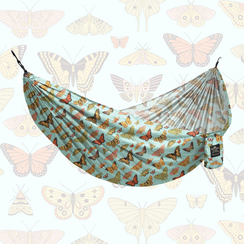 Double Hammock (Butterfly Dreams) - Hanging Straps Sold Separately with vibrant butterfly prints in a relaxing setup.