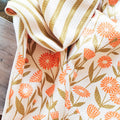 Calendula Flowers Kitchen & Tea Towel featuring vibrant floral and striped designs, eco-friendly and super absorbent.