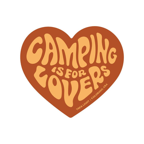 Heart-shaped 'Camping Is For Lovers' sticker by Trek Light, brown text on beige background. Durable, weatherproof, USA-made vinyl sticker.