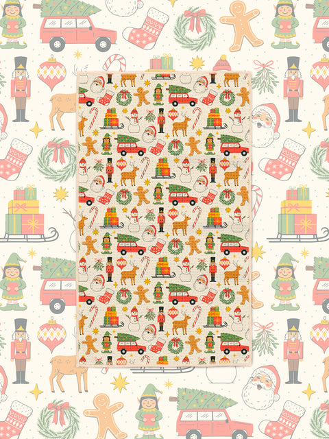 Holiday kitchen tea towel with festive Christmas icons on a matching cream pattern backdrop