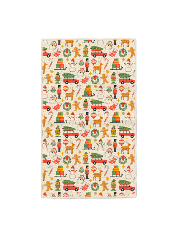 Christmas Vibes kitchen tea towel with Santa, snowmen, nutcrackers, reindeer and gingerbread on cream