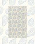Coastal Oysters Kitchen & Tea Towel with blue line-drawn oysters on a cream background