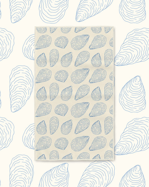 Coastal Oysters Kitchen & Tea Towel with blue line-drawn oysters on a cream background