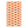 Kitchen tea towel with orange crab pattern on cream waffle-weave fabric, large crabs scattered across the towel with a
