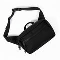 Everyday Fanny Pack (Eclipse) with multiple zippered pockets and adjustable strap, ideal for travel and daily use.