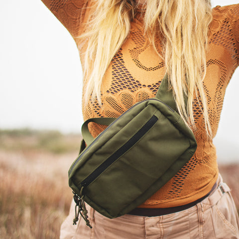 Woman wearing Everyday Fanny Pack (Fern) crossbody, showcasing stylish and functional design with waterproof zippers and spacious compartments.