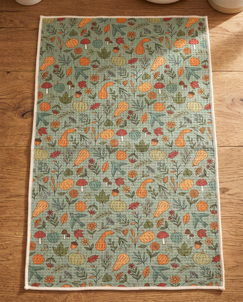 Fall Harvest waffle kitchen tea towel reverse side laid flat: sage-green with pumpkins, gourds, leaves and birds