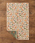 Fall Harvest waffle kitchen tea towel flat lay with a corner folded up to reveal the reverse print