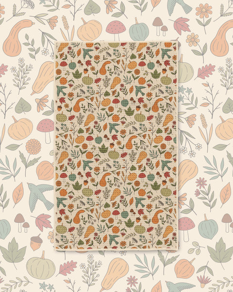 Fall Harvest Kitchen & Tea Towel with pumpkins, gourds, mushrooms and autumn leaves in muted orange and green