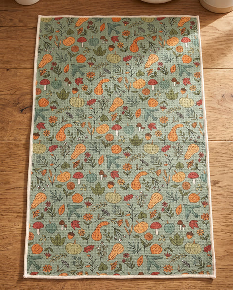 Fall Harvest waffle kitchen tea towel reverse side laid flat: sage-green with pumpkins, gourds, leaves and birds