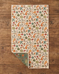 Fall Harvest waffle kitchen tea towel flat lay with a corner folded up to reveal the reverse print