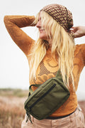 Everyday Fanny Pack (Fern) worn by a woman in a stylish outfit outdoors, showcasing its functional design.