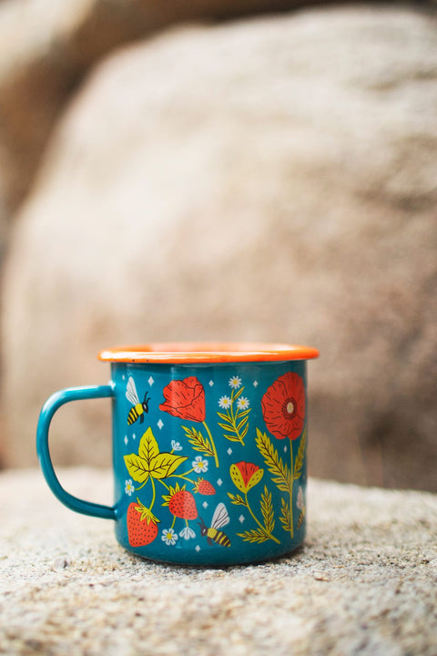 Garden Buzz Enamel Mug 16oz featuring vibrant flowers and bees, perfect for outdoor adventures by Trek Light.