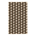 Reverse side of Ghost Garden tea towel on dark brown with cream ghosts, orange flowers and Trek Light woven tag