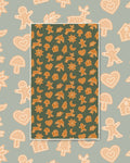 Gingerbread Kitchen & Tea Towel with orange gingerbread cookies, stars and moons on a dark green background
