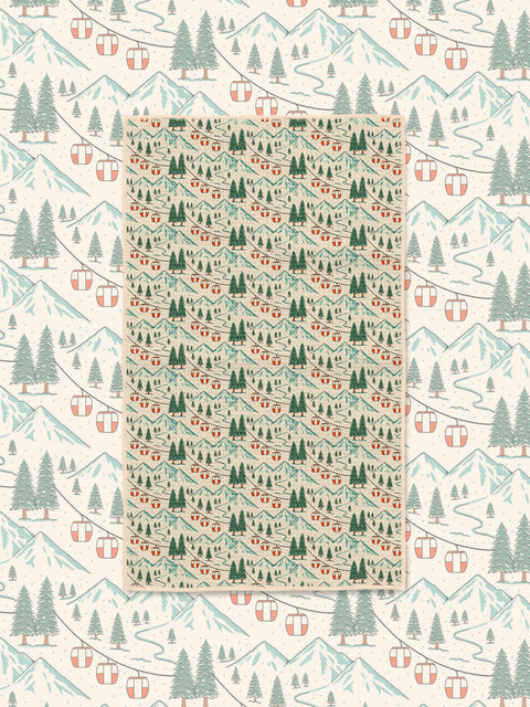 Close-up of Gondola Winter microfiber towel showing detailed snowy mountains, red gondola cars, and pine forest print