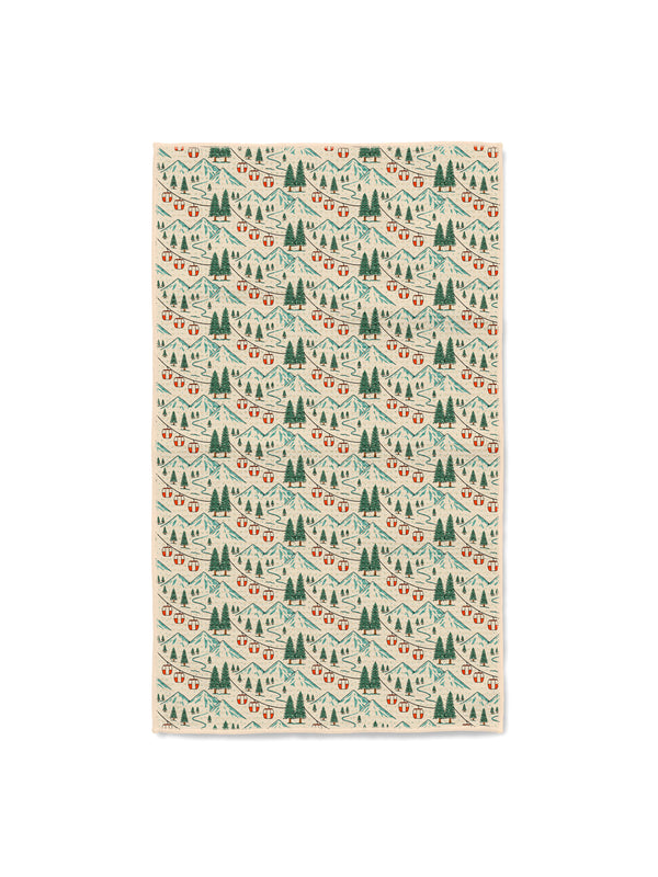 Trek Light Gondola Winter dish towel featuring alpine peaks, ski lift gondolas, and evergreen trees in a winter scene