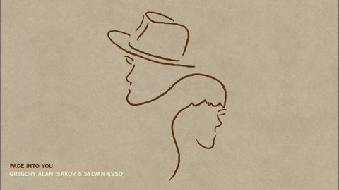 Minimalist line art of a man and woman's profiles on a textured background for 'Fade Into You' by Gregory Alan Isakov & Sylvan Esso.