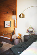 Stylish living room featuring the Greyson Blanket draped over a couch with decorative elements.