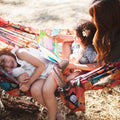 Double Hammock & Pro Hanging Straps (Midnight Mushroom Print) - Family enjoying reading in a colorful hammock.