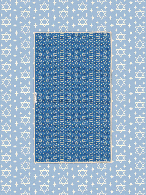 Blue Star of David kitchen towel styled flat on matching light blue star-print background